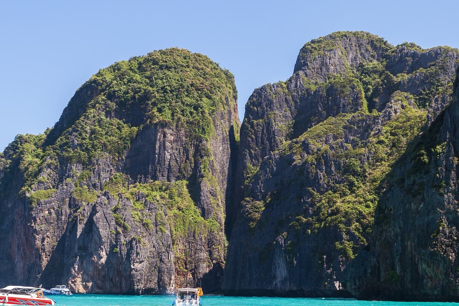 Limestone cliffs above clear water at Phi Phi