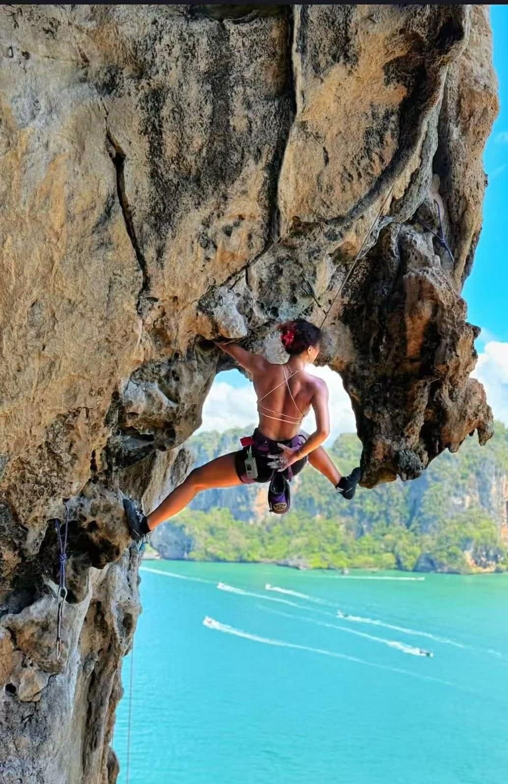 Climbing an overhang above the sea
