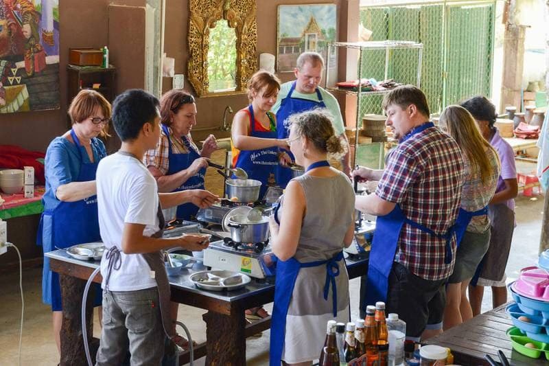 A class at the gas burners in the open kitchen